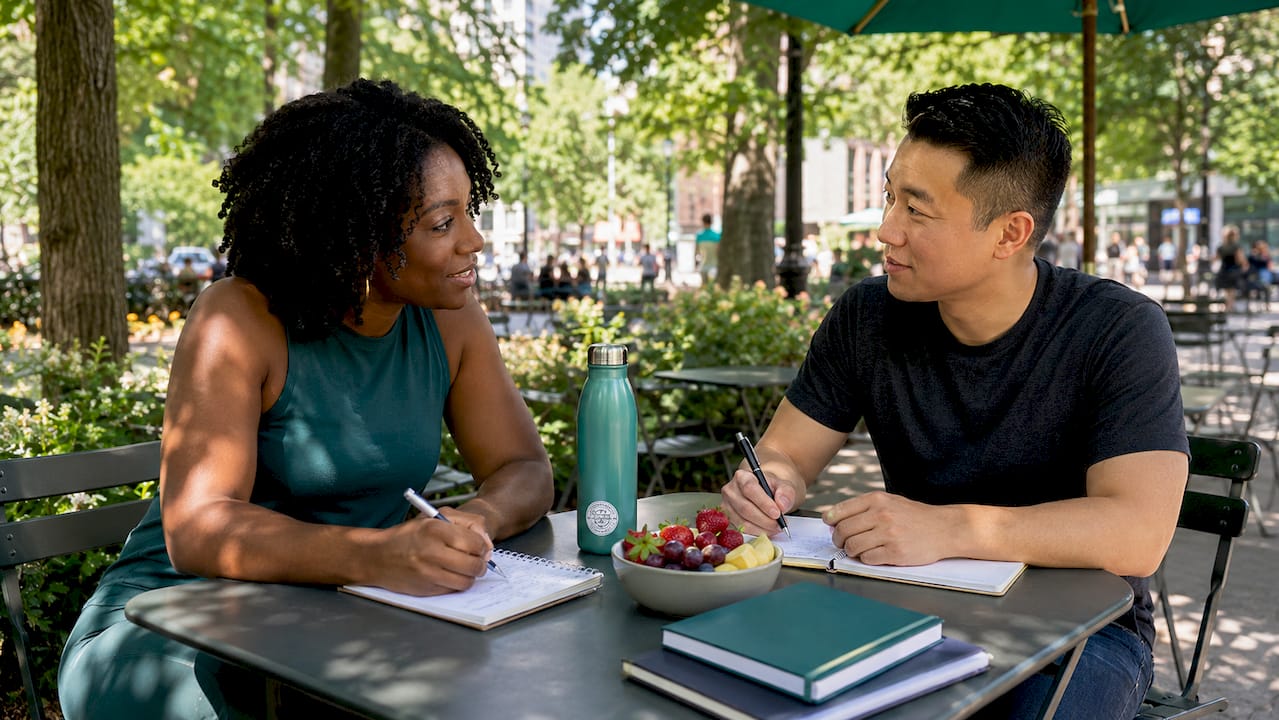Two people doing joint wellness accountability