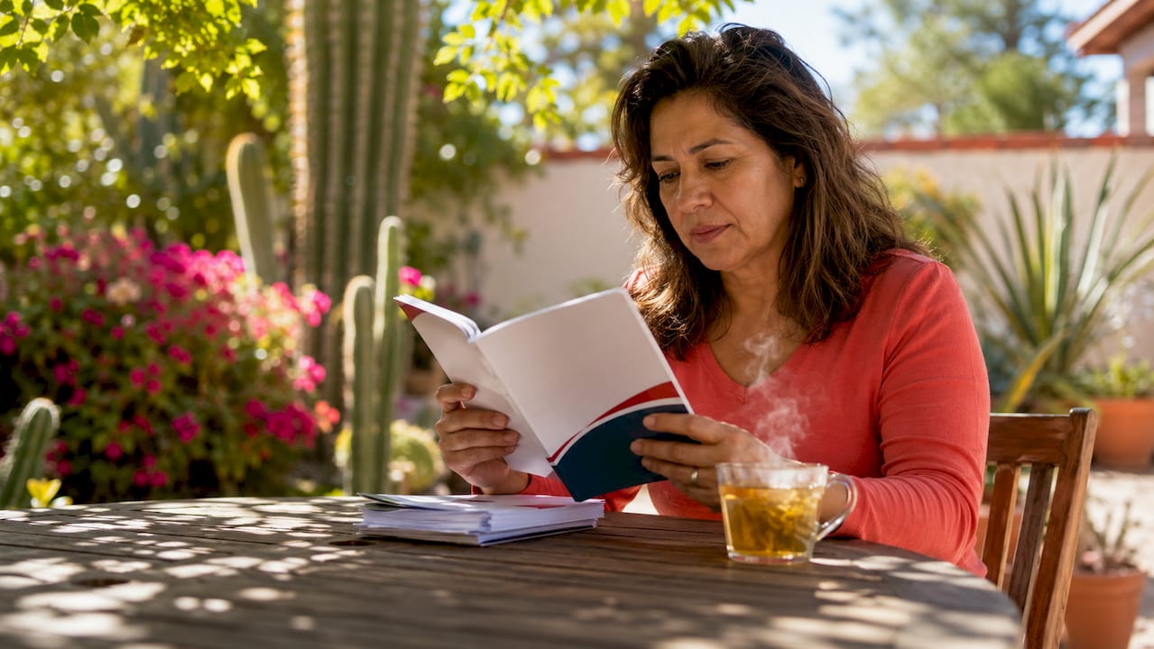 Person reading Arizona boating law booklet