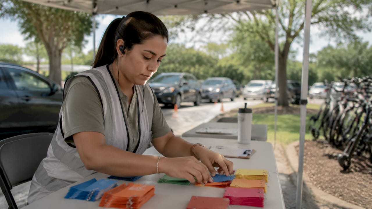 Parking manager sorting color-coded tickets