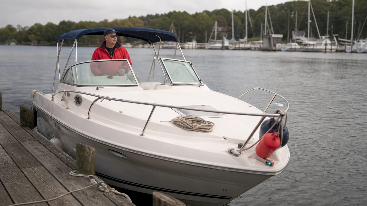 Boat approaching dock at idle speed for safe mooring