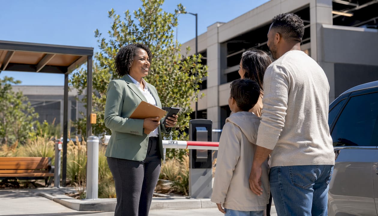 Hotel parking manager assisting vehicle at entrance