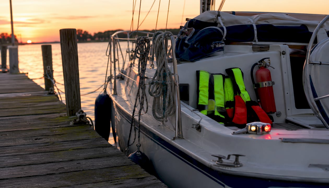 Sailboat docked with visible safety equipment