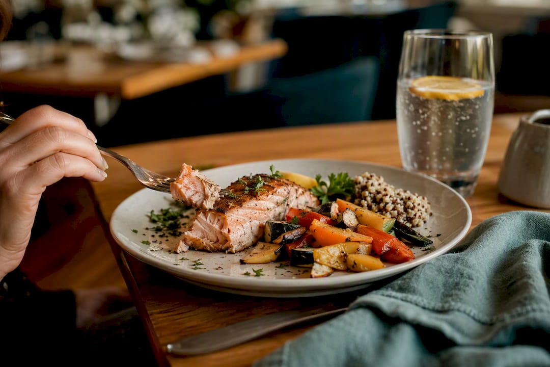 Balanced restaurant plate with protein and vegetables