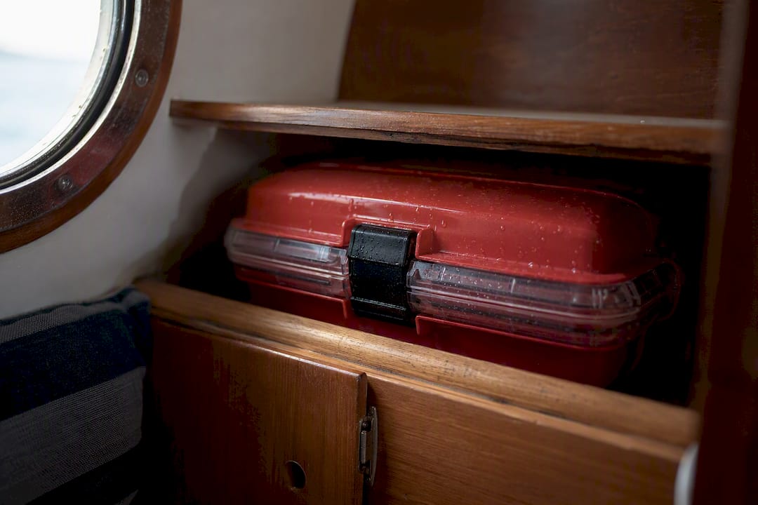 Waterproof flare storage container inside boat locker