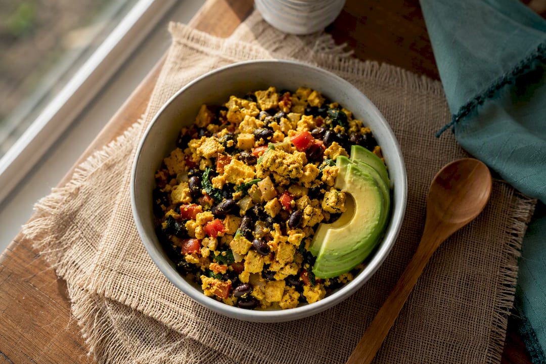 Tofu scramble bowl with black beans and avocado