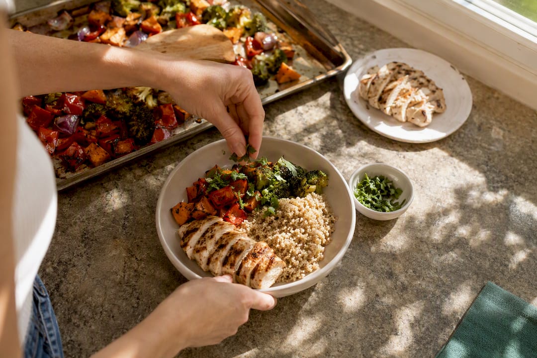 Hands portioning balanced healthy meal