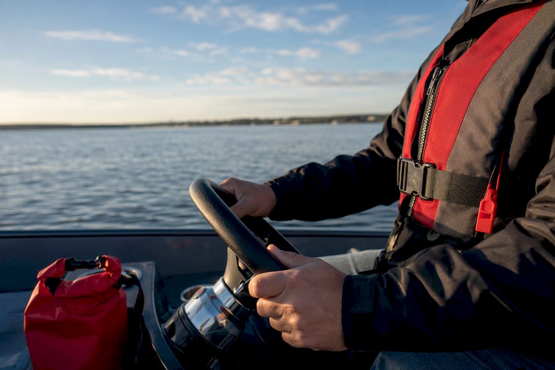 Boater operating vessel on Long Island water