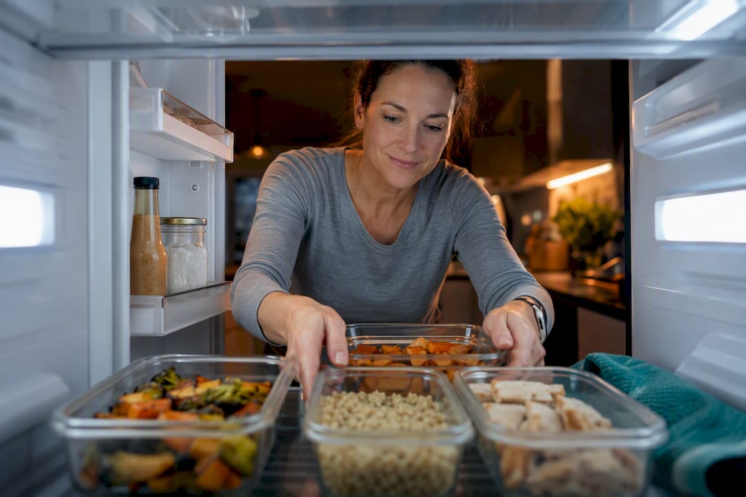 Meal prep components organized in refrigerator