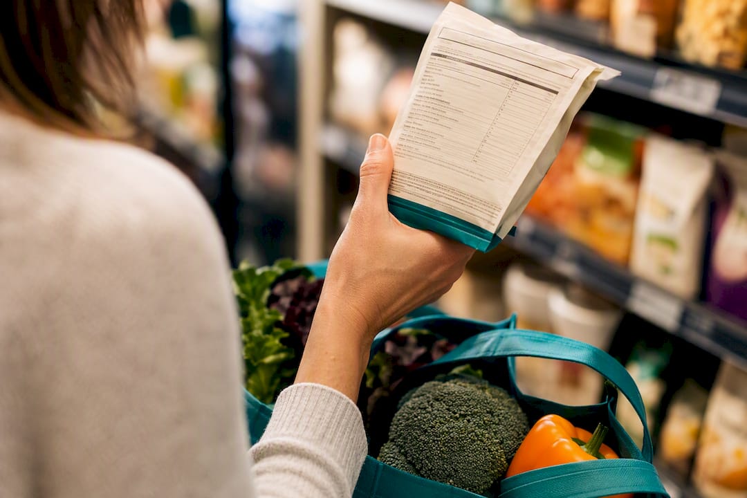 Shopper checking an ingredient label