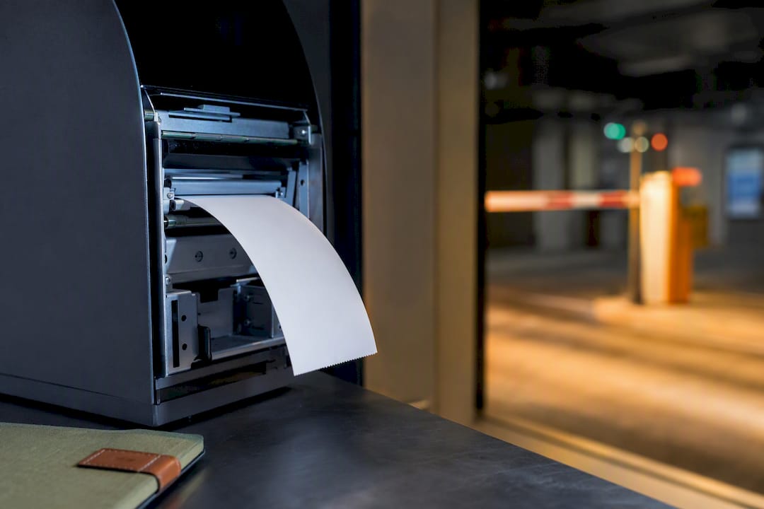 Thermal ticket emerging from printer