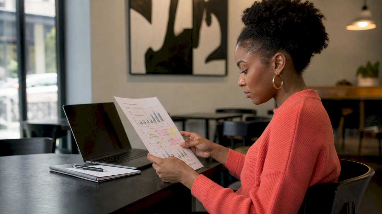 Woman reviewing ad auction and quality scores