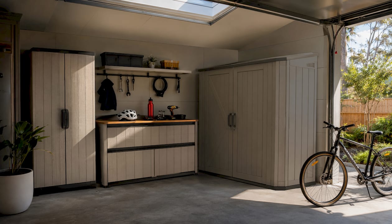 Keter resin storage shed and cabinets in garage corner