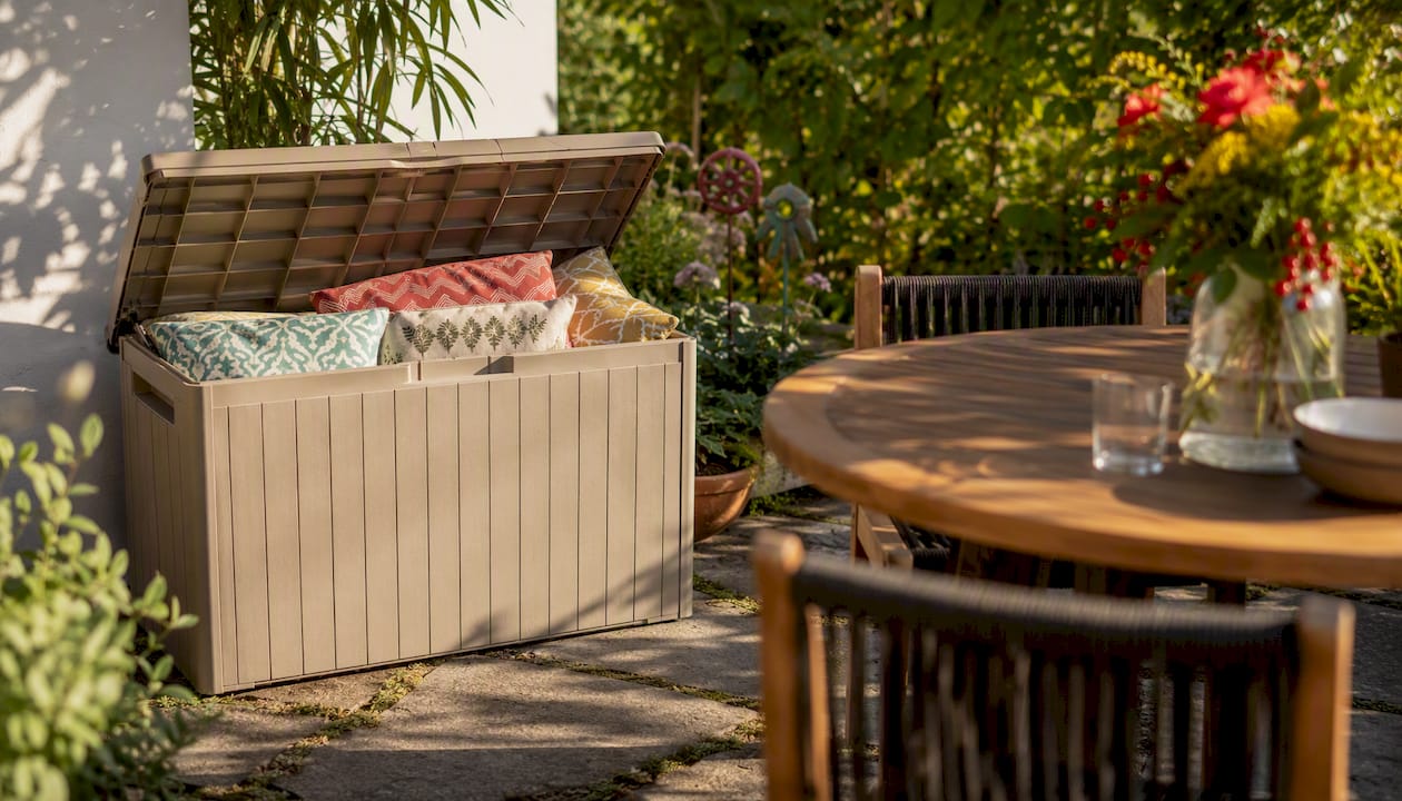 Keter storage bench with cushions in backyard alfresco