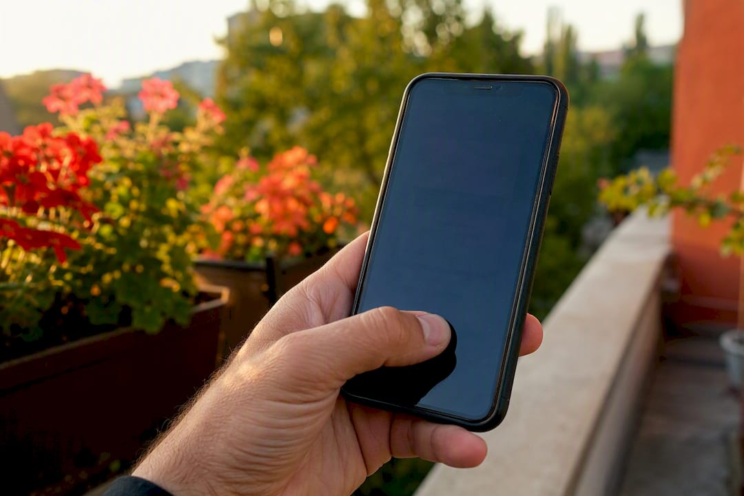 Thumb reaching touchscreen bottom area on phone