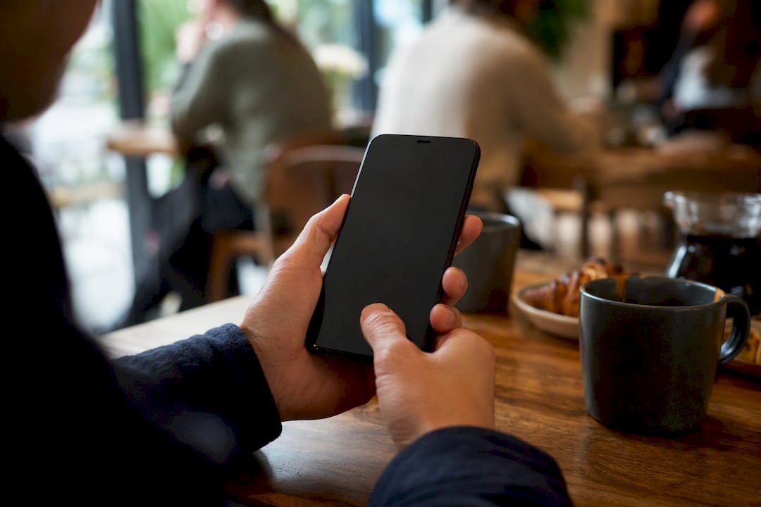 Thumb tapping sticky Add to Cart on smartphone