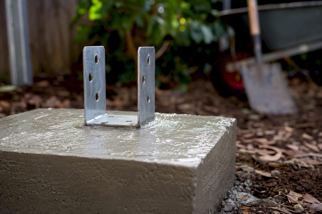 Concrete footing with galvanised stirrup embedded