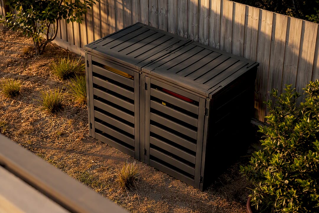 Slatted ventilation gaps on wheelie bin enclosure