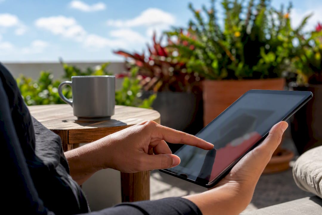 Hands tapping chat assistant on product page tablet