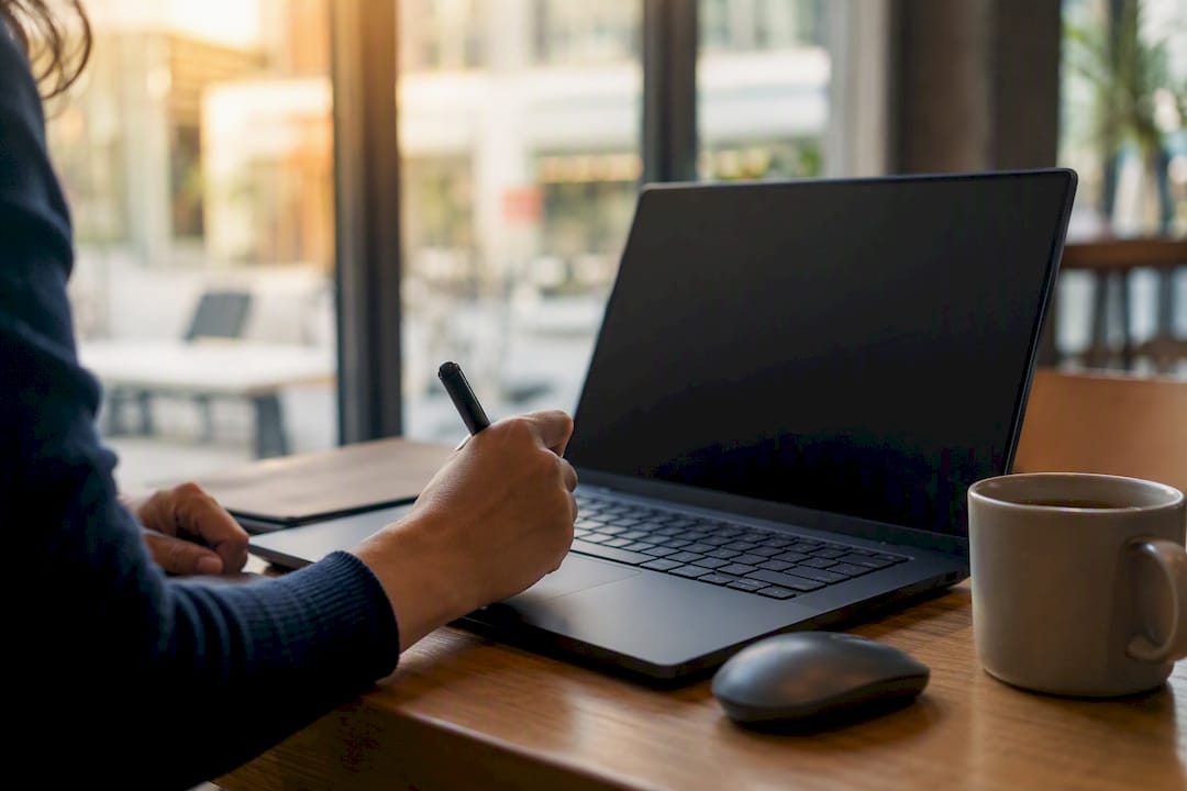 Blurred marketing data screen with hand and keyboard