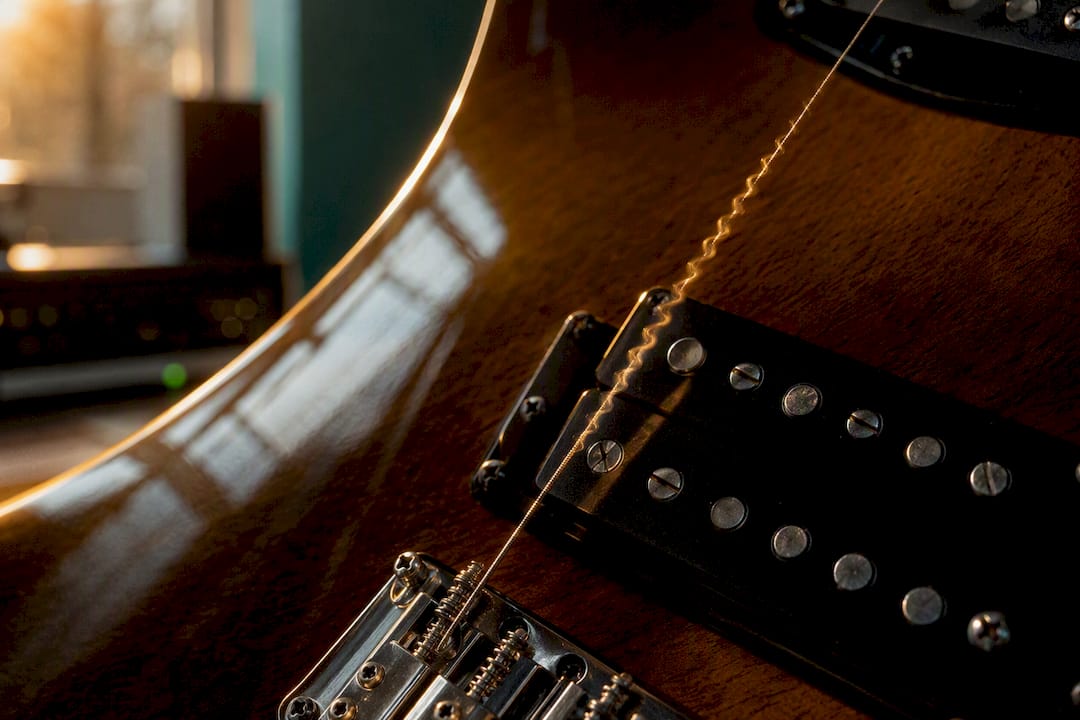 Guitar string vibrating close-up