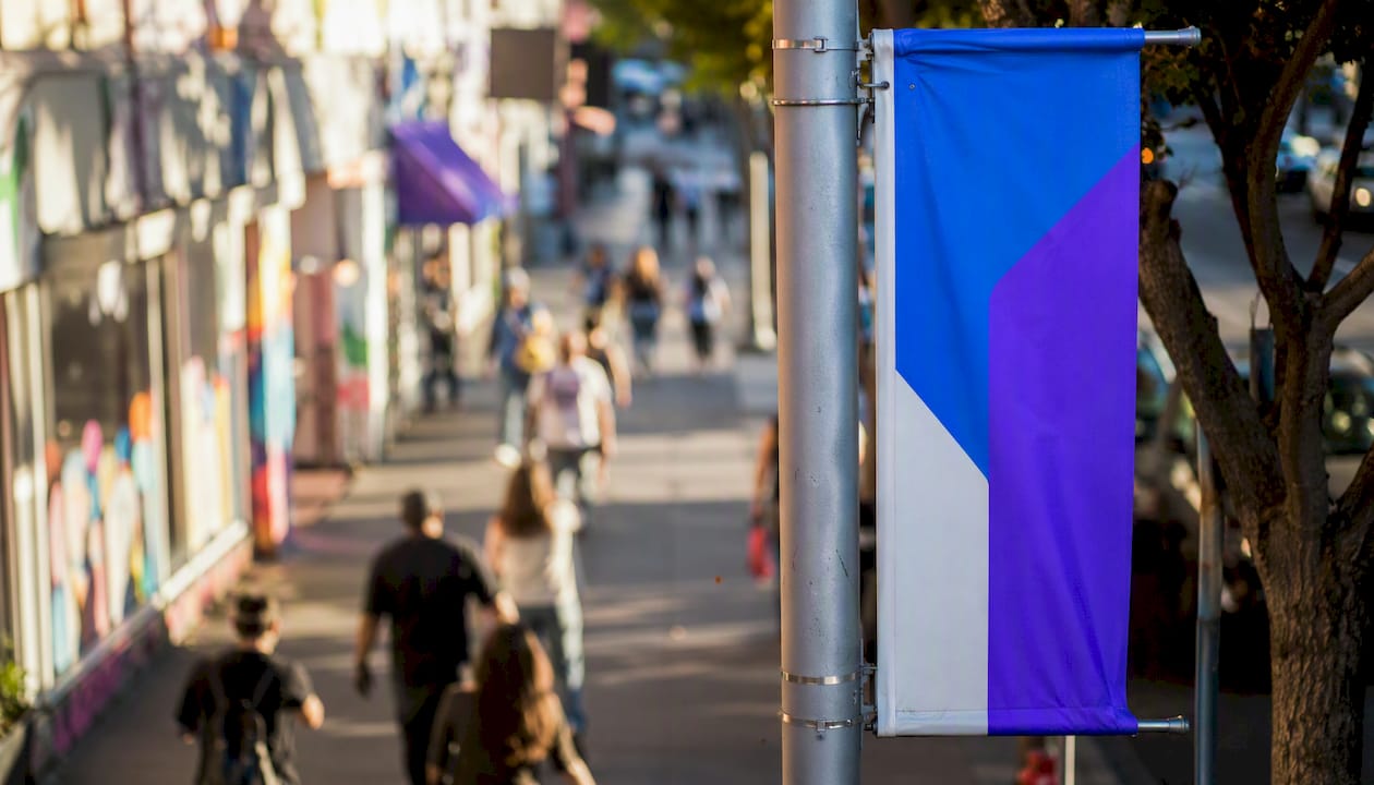 Pole banner mounted on urban street lamp
