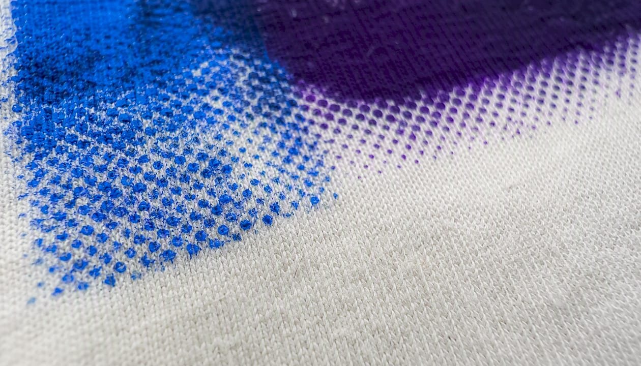 Macro view of halftone dots on garment fabric