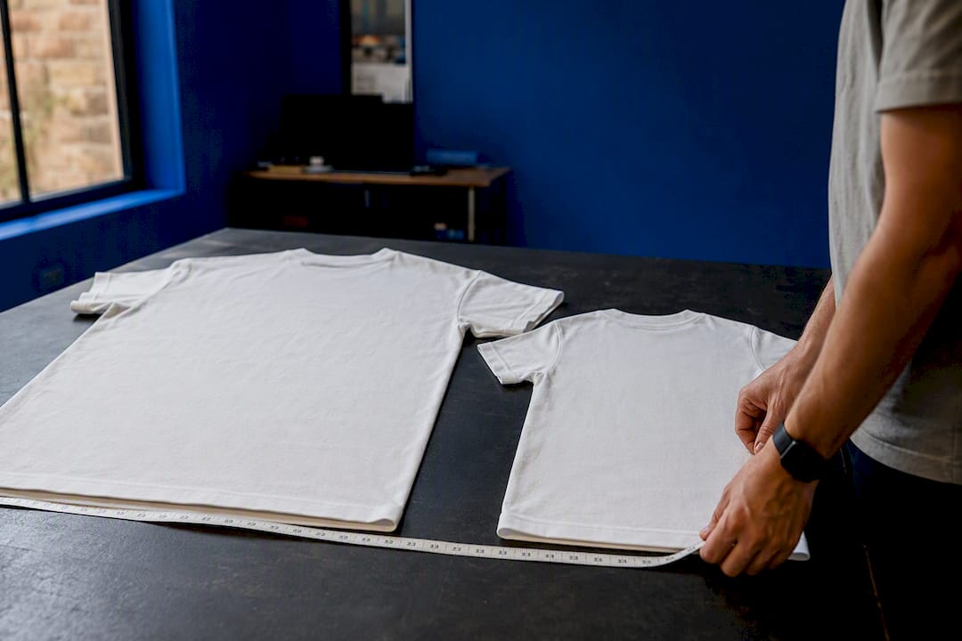 Adult and youth t-shirts showing scale difference