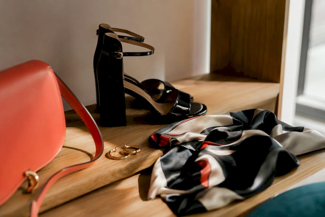 Cocktail shoes and accessories on table