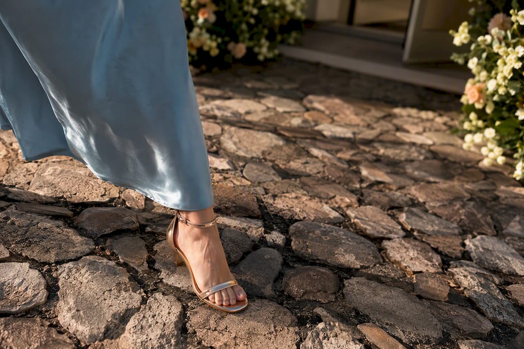 Guest footwear navigating uneven wedding cobbles