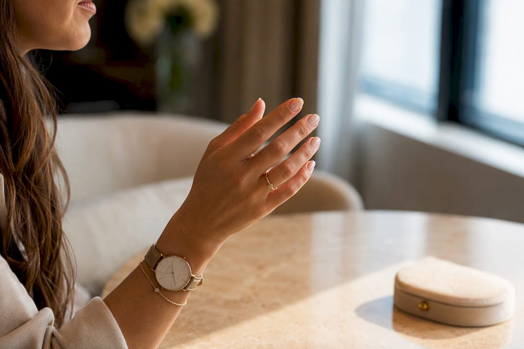 Neat nails and understated interview accessories