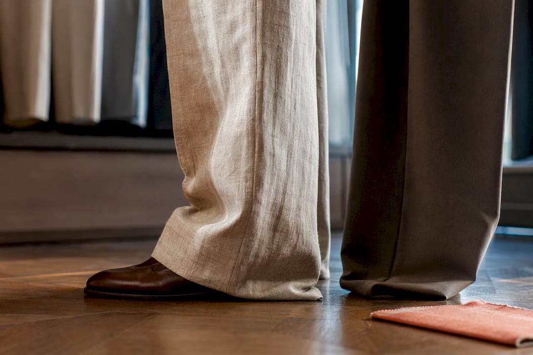 Wide-leg trouser hems showing fabric drape