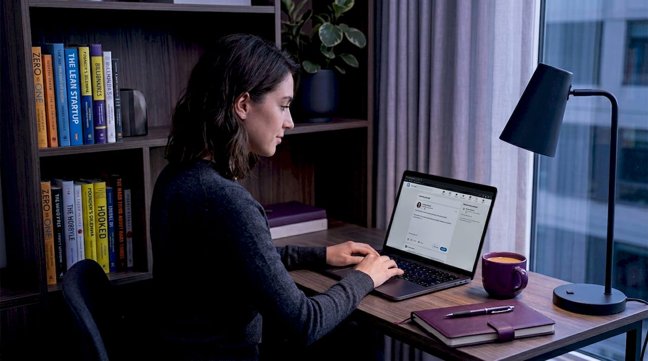 Founder writing LinkedIn content at home office