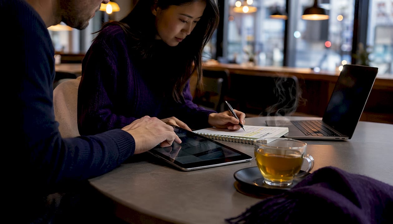 Hands collaborating on LinkedIn content plan