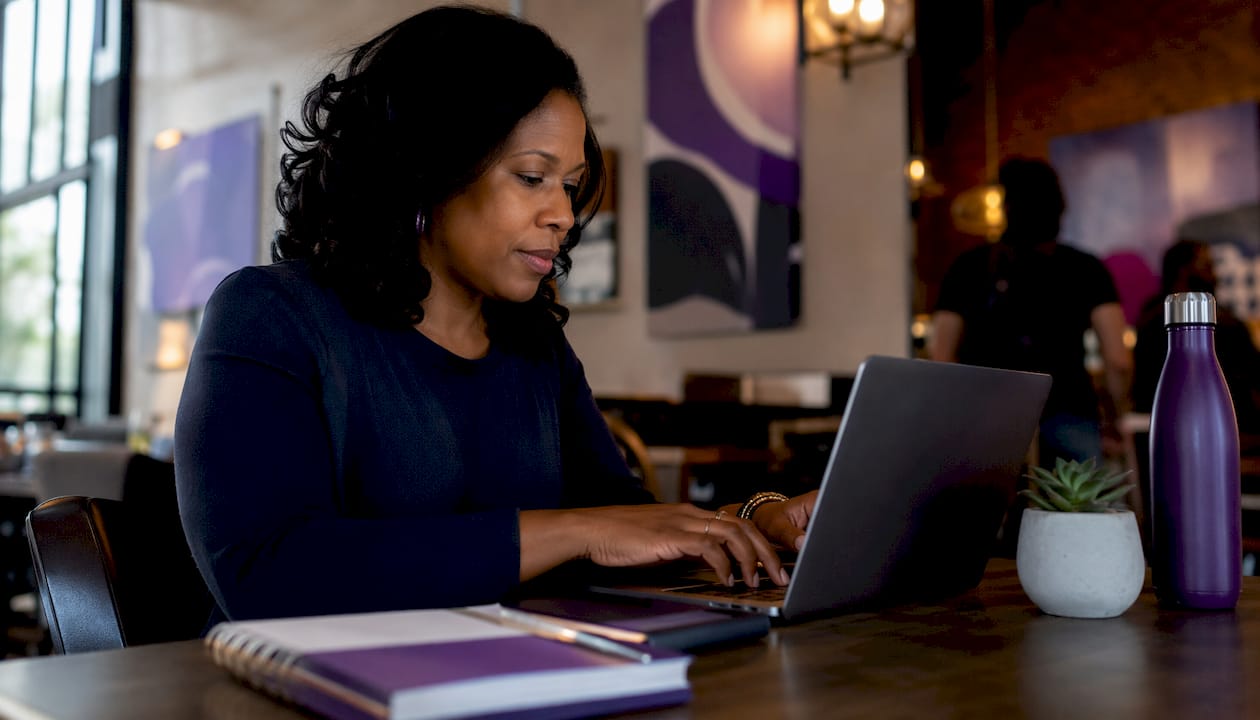 Founder scheduling LinkedIn posts on laptop