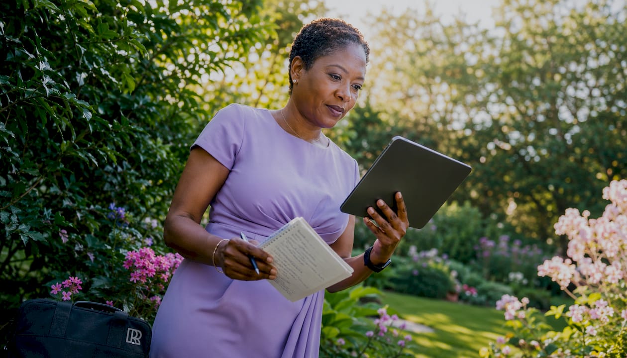 Black woman marketer reviewing marketing tools at desk