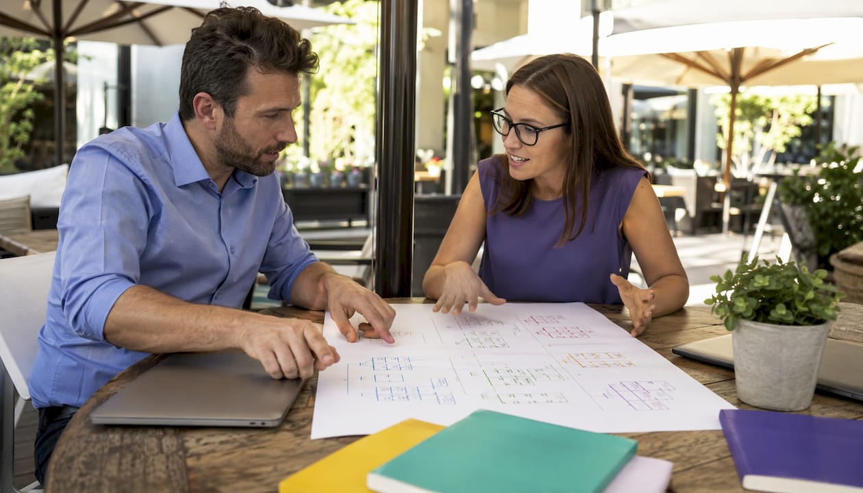 Two professionals discussing sitemap types chart