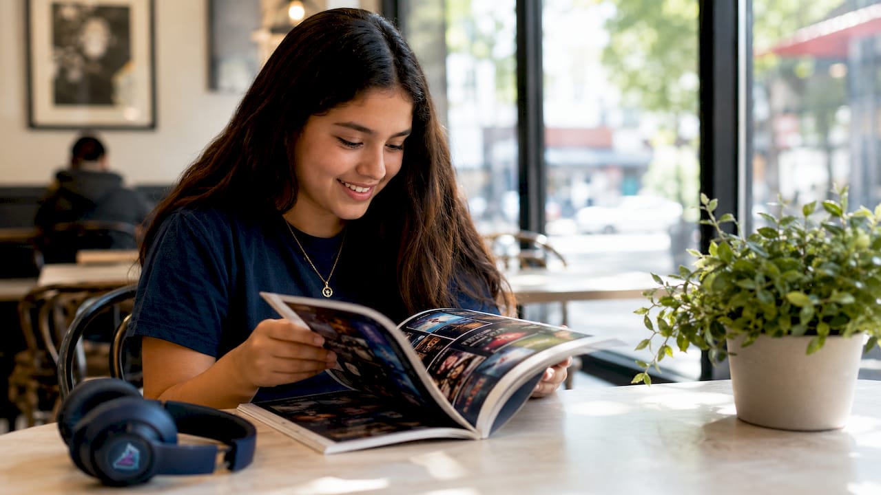 Hands browsing audiobook catalog in library