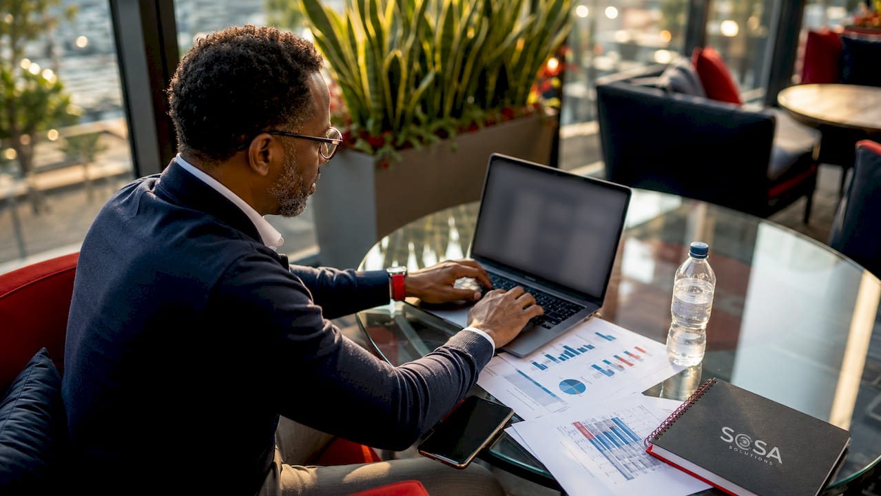 Man setting up SMB helpdesk software at desk