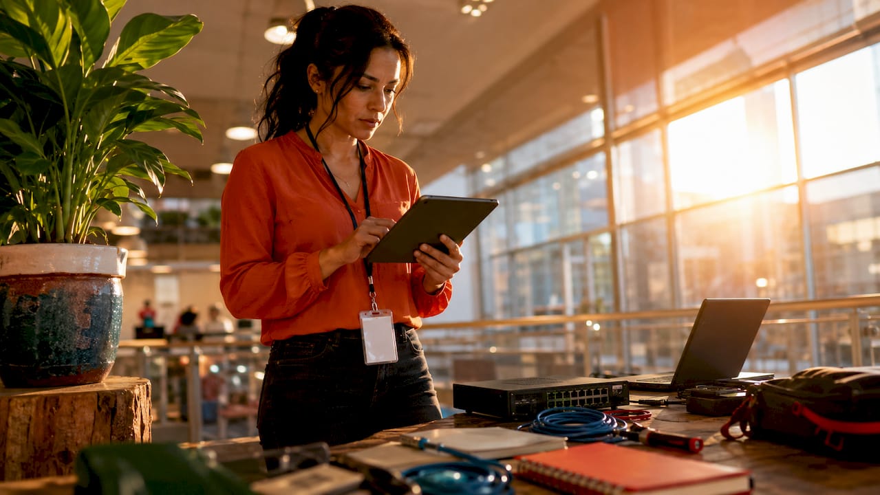 IT manager managing retail network in store office