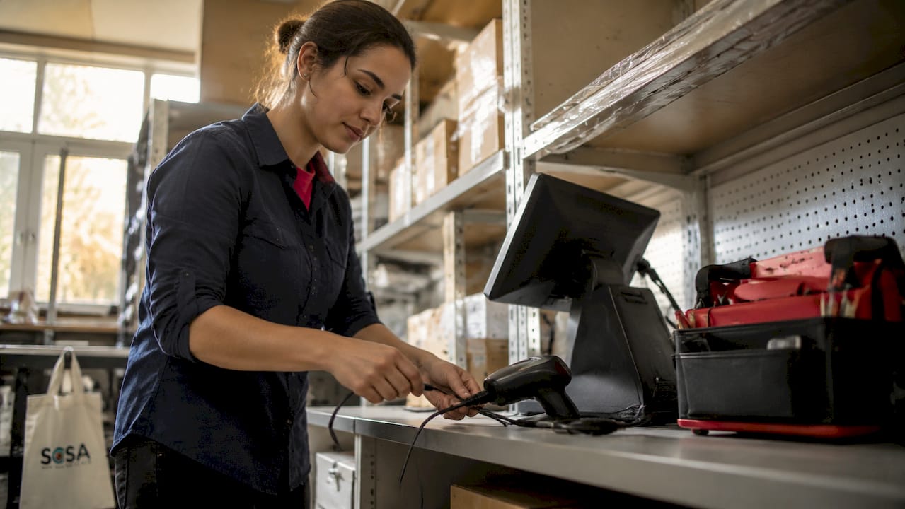 IT specialist connecting retail systems hardware