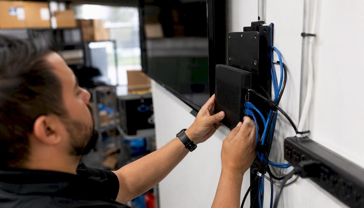 Hands wiring digital signage display