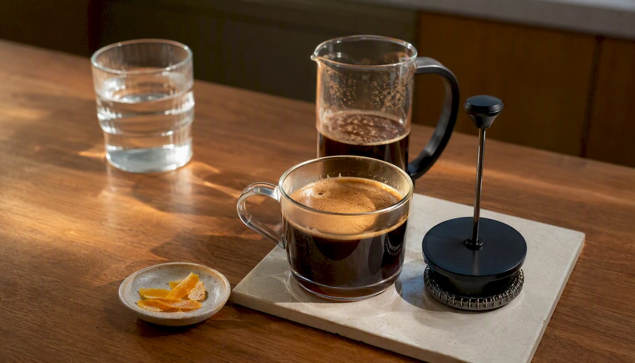Close-up of French press coffee surface showing oils and body