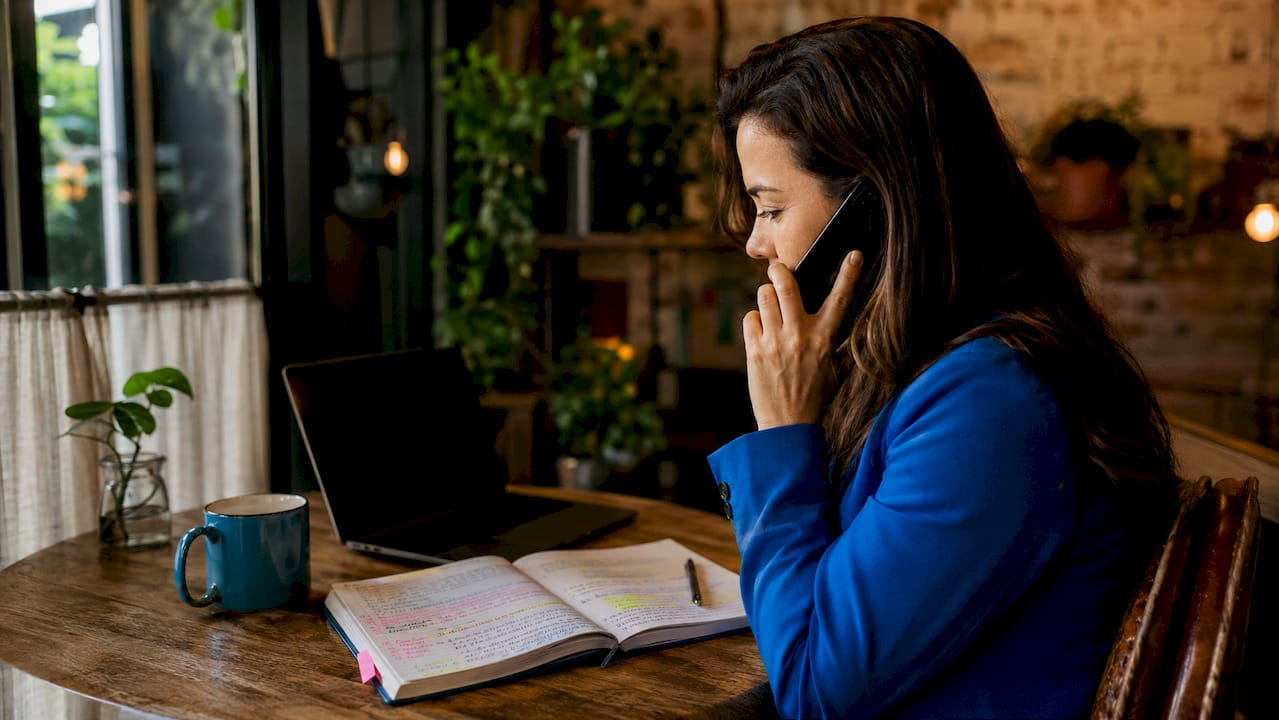 Project manager consulting app agency on phone