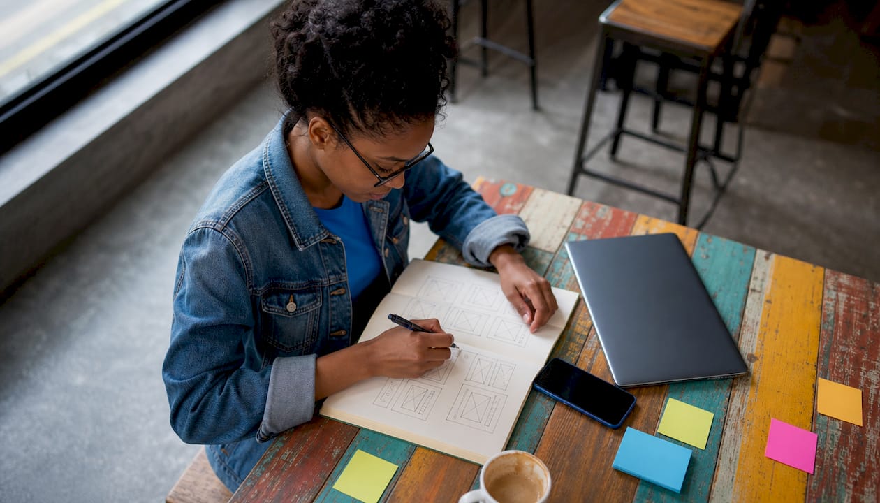 Developer sketching mobile MVP app design