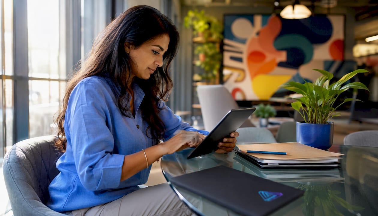 Manager reviewing employee app on tablet