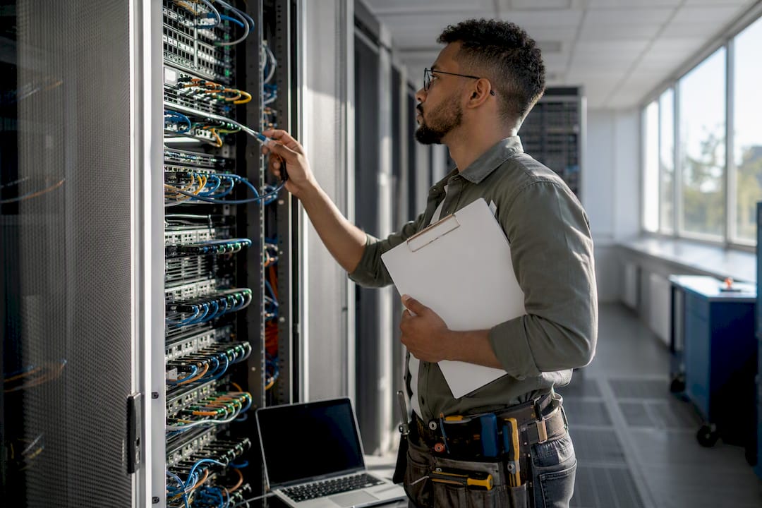 Hands managing network cables during security incident response