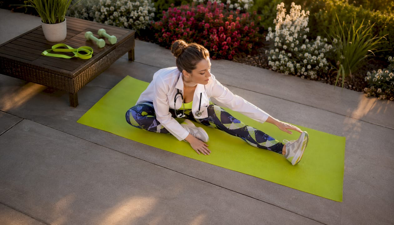 Stop Losing Muscle: Proven Strategies That Actually Work 1 Female doctor stretching in elegant living room