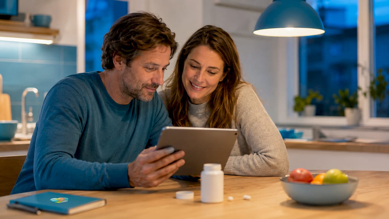 Parents reviewing child medication app together