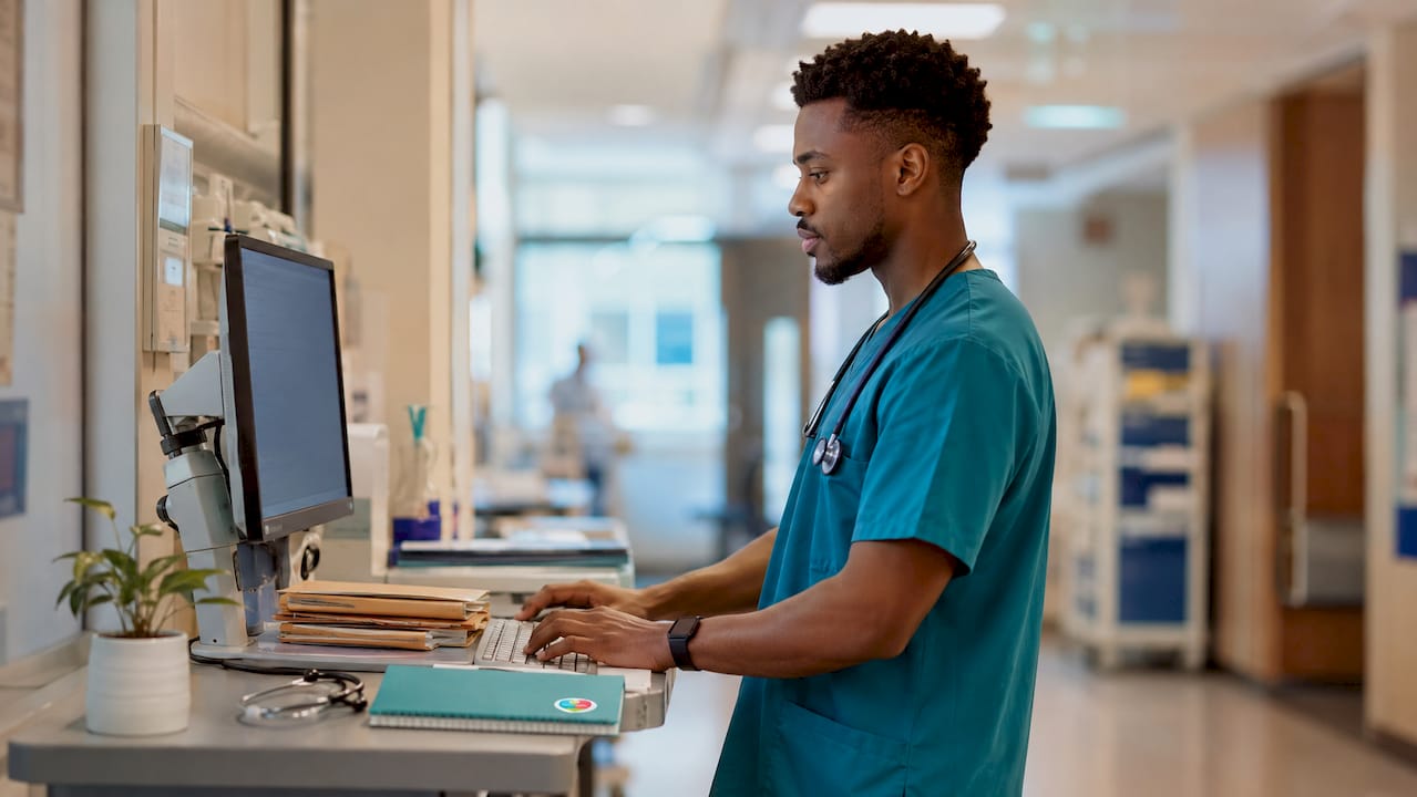 Nurse preparing patient reminders in hospital office