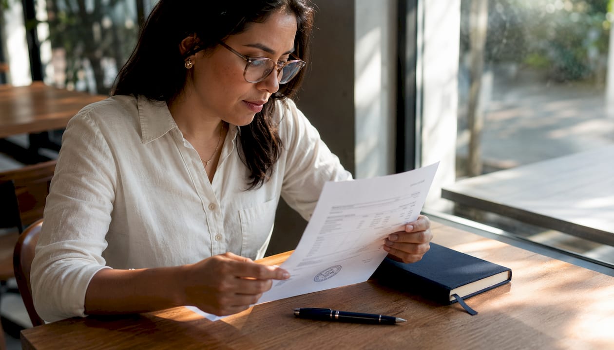 Woman reviewing commercial invoice for notarization